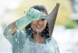 Make sure your squeegee is clean. Shot of a young woman cleaning her windows