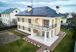 Modern residential house with solar panel system on roof.