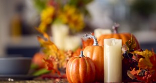 Autumn Or Fall Table Decoration At Home With Pumpkins Candle And Leaves