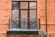 facade-of-old-house-with-beautiful-balcony-with-sn-2023-11-27-05-36-31-utc-min