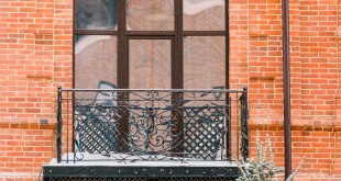 facade-of-old-house-with-beautiful-balcony-with-sn-2023-11-27-05-36-31-utc-min