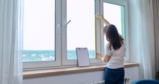 woman-measuring-window-with-tape-measure-tailorin-2024-12-08-03-42-26-utc_Easy-Resize.com
